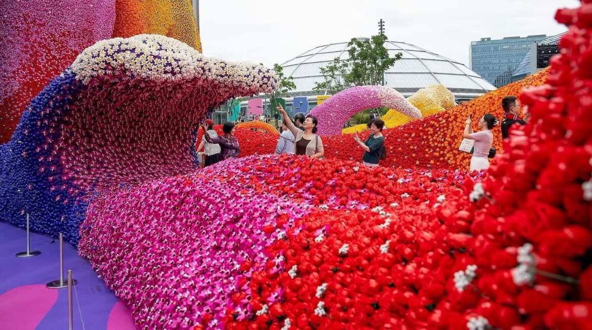 LEGO Botanical Wave installation of brick-built flowers flowing from a former oil tank at TANK Shanghai.
